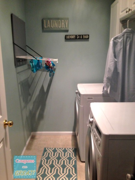 laundry room with drying rack.